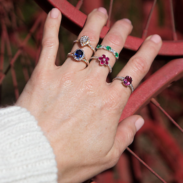 woman's hand with various rings