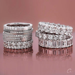 close-up view of luxurious collection of diamond wedding and anniversary eternity bands by a.jaffe in white gold or platinum